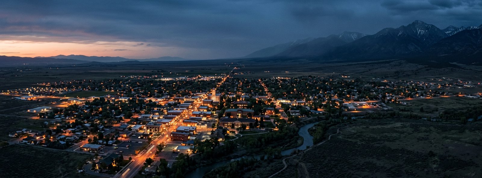 Aerial view of the Alamosa, Colorado skyline at dusk, illustrating the metro area TactStack serves structural steel businesses in