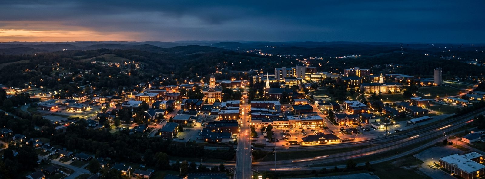 Aerial view of the Cookeville, Tennessee skyline at dusk, illustrating the metro area TactStack serves plumbing businesses in