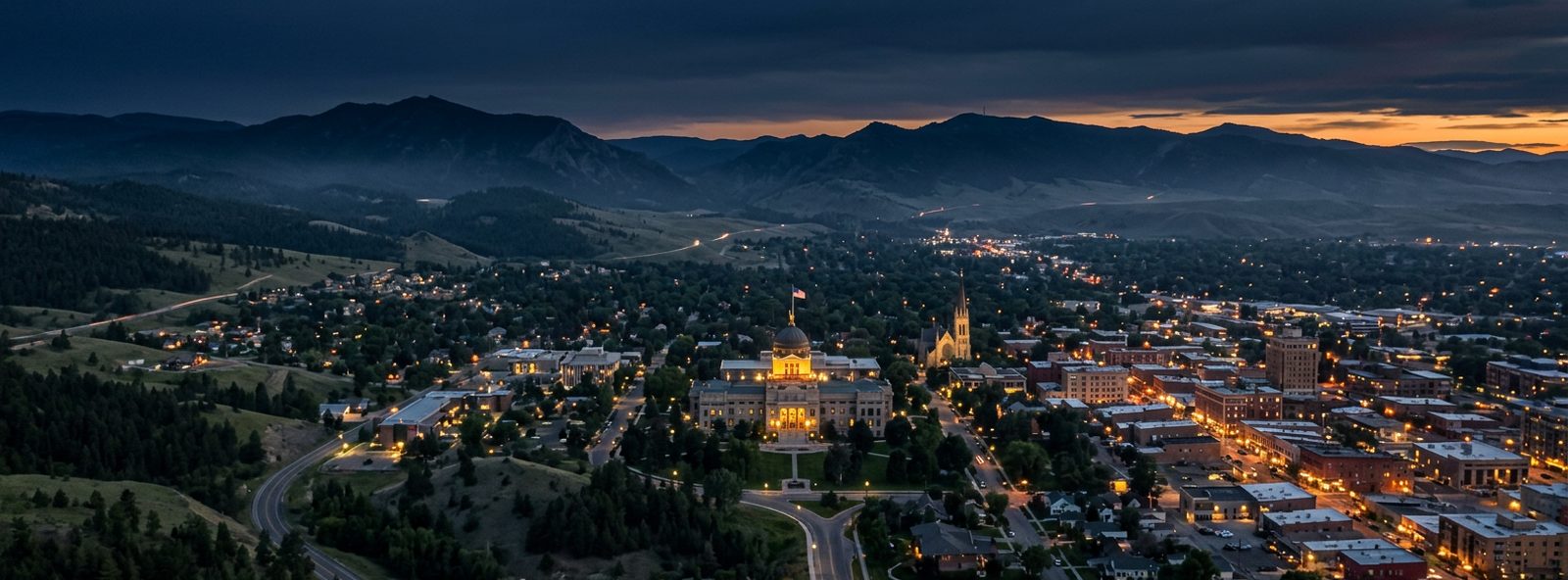 Aerial view of the Helena, Montana skyline at dusk, illustrating the metro area TactStack serves structural steel businesses in