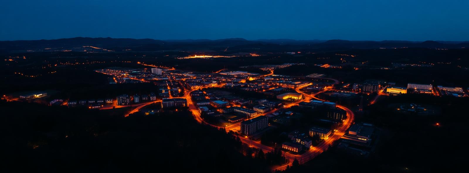 Aerial view of the Hickory, North Carolina skyline at dusk, illustrating the metro area TactStack serves structural steel businesses in