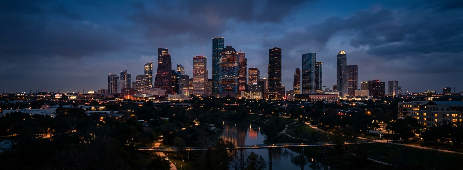 Aerial view of the Houston, Texas skyline at dusk, illustrating the metro area TactStack serves structural steel businesses in