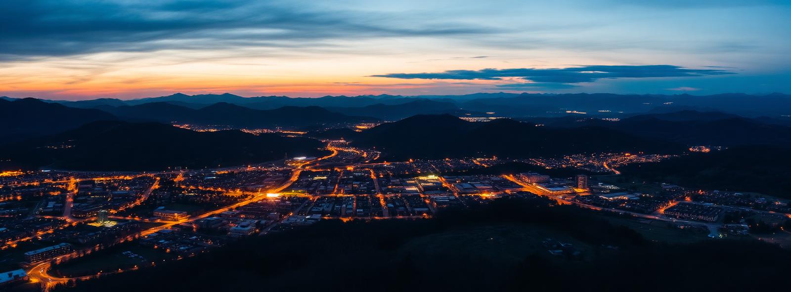 Aerial view of the Johnson City, Tennessee skyline at dusk, illustrating the metro area TactStack serves structural steel businesses in