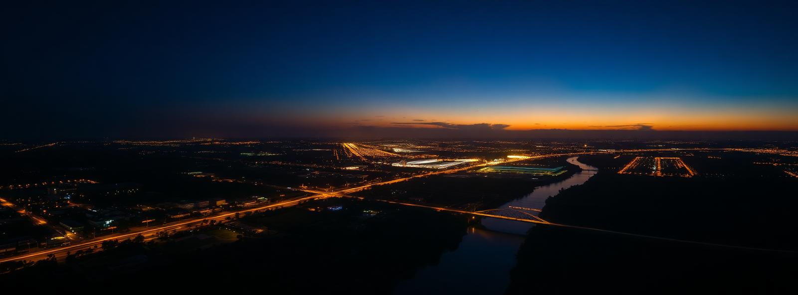 Aerial view of the Lafayette, Louisiana skyline at dusk, illustrating the metro area TactStack serves structural steel businesses in