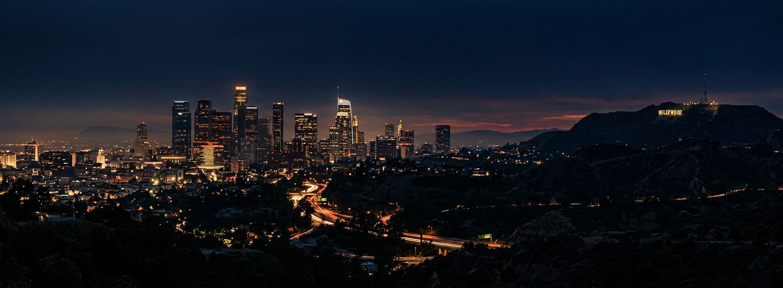 Aerial view of the Los Angeles, California skyline at dusk, illustrating the metro area TactStack serves structural steel businesses in