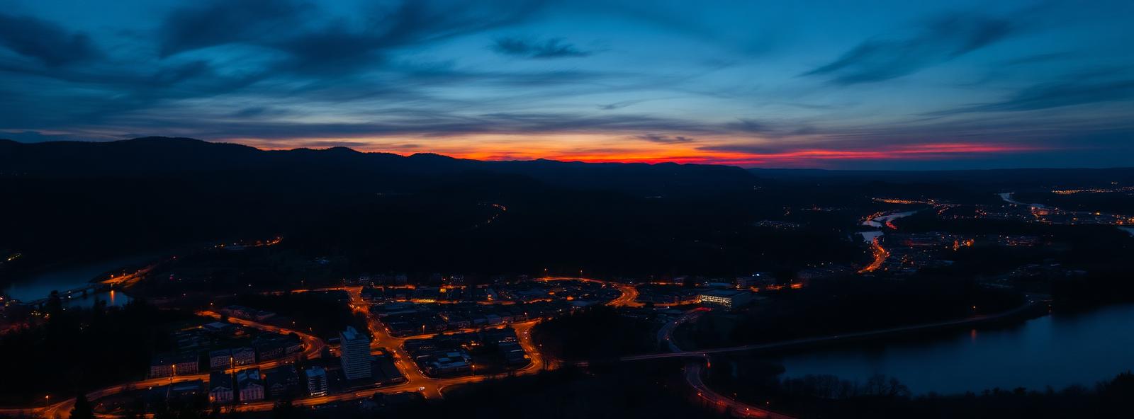 Aerial view of the Lynchburg, Virginia skyline at dusk, illustrating the metro area TactStack serves structural steel businesses in