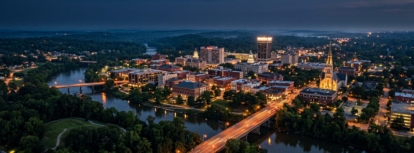 Aerial view of the Macon, Georgia skyline at dusk, illustrating the metro area TactStack serves electrical businesses in