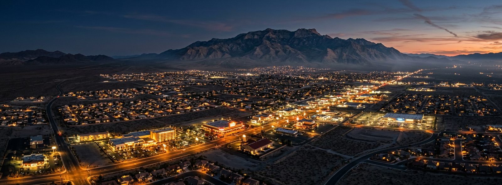 Aerial view of the Pahrump, Nevada skyline at dusk, illustrating the metro area TactStack serves structural steel businesses in