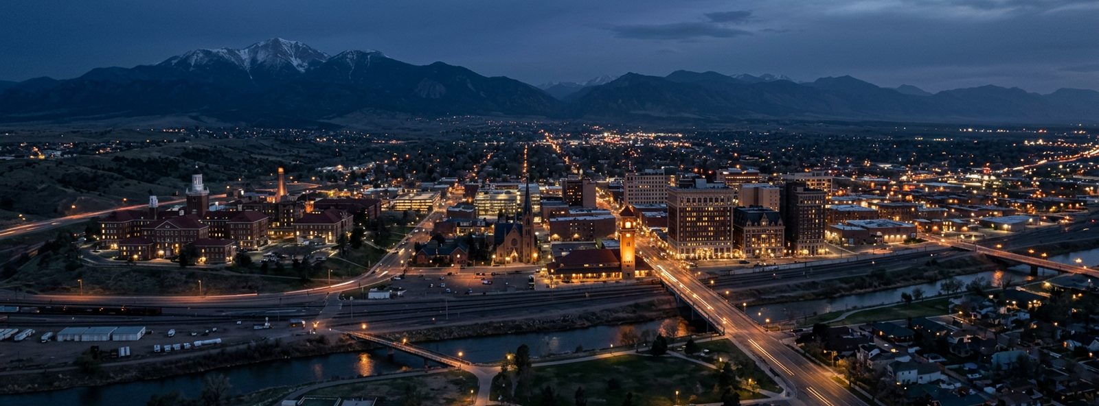 Aerial view of the Pueblo, Colorado skyline at dusk, illustrating the metro area TactStack serves structural steel businesses in